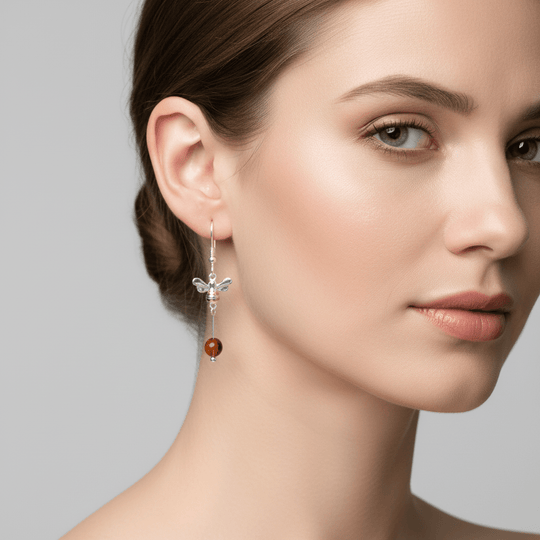 Model wearing bee and amber earrings