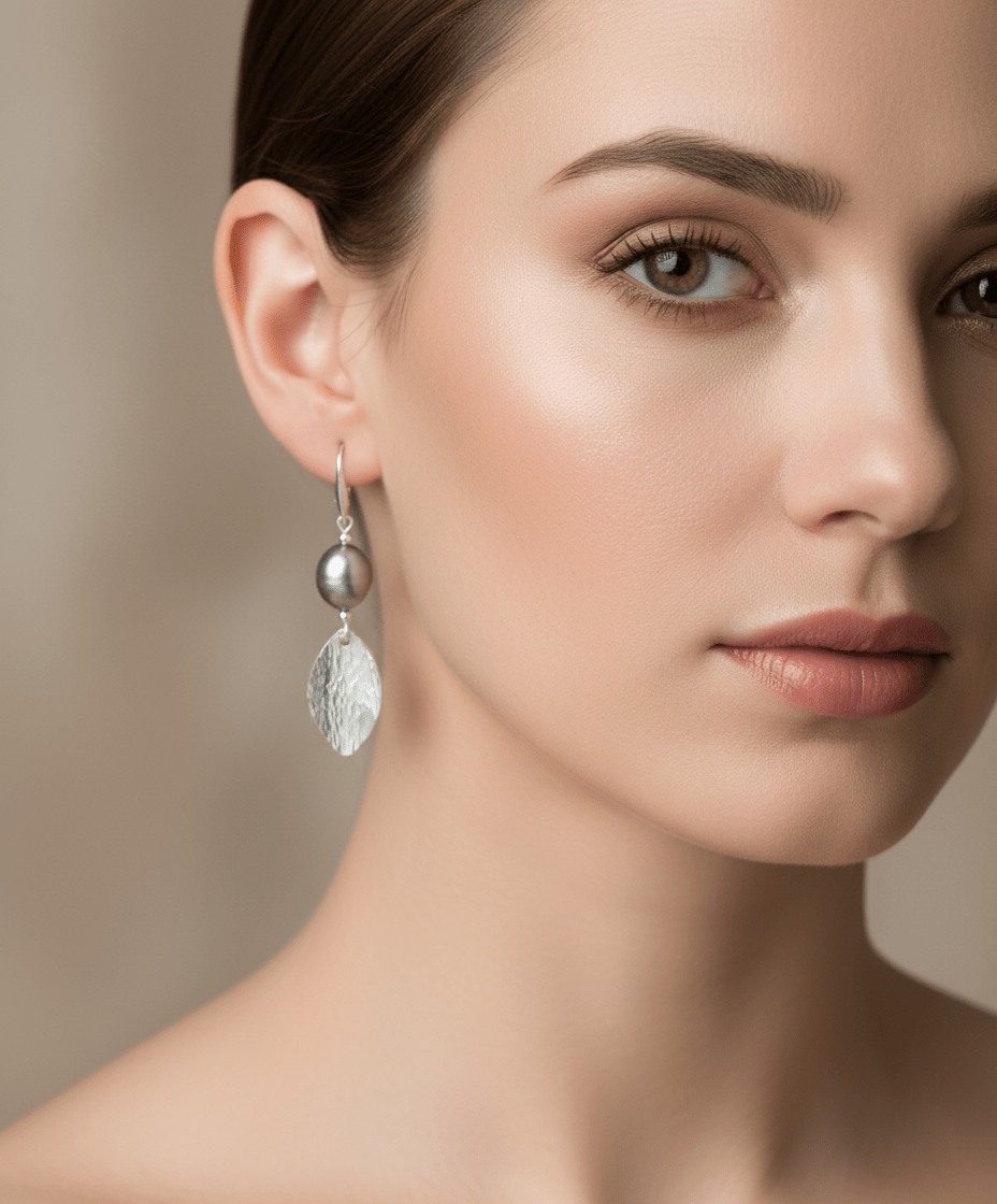 Model wearing Grey Baroque Pearl & Hammered Leaf Earrings