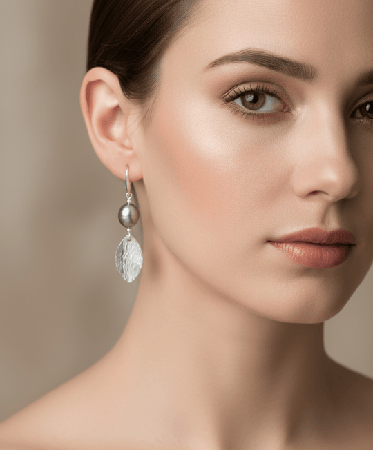 Model wearing Grey Baroque Pearl & Hammered Leaf Earrings