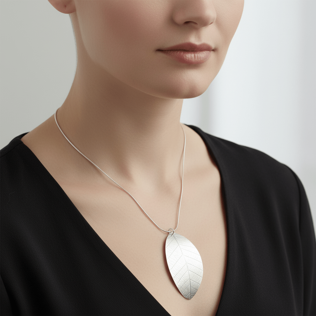 Model wearing sterling silver leaf necklace close-up