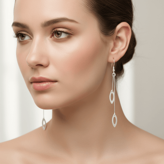 Model wearing sterling silver drop earrings