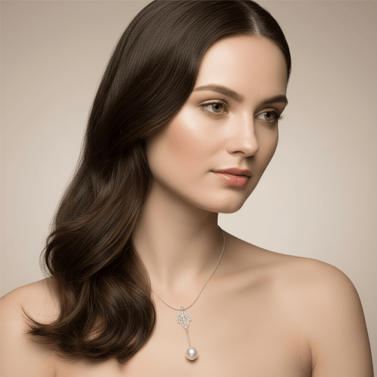 Model wearing sterling silver leaf necklace with silver pearl