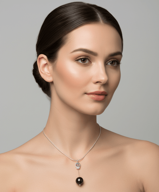 Sterling silver skull and black pearl vertical pendant necklace on model