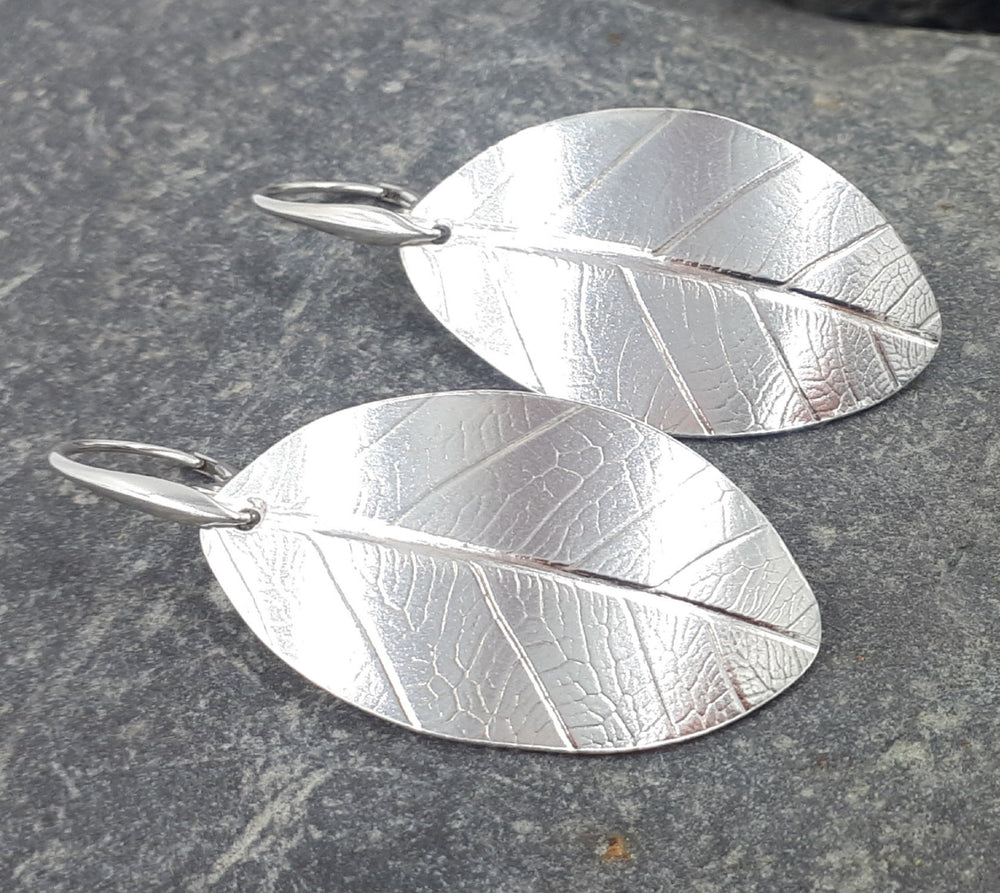 Large sterling silver leaf textured earrings front view, handmade hallmarked UK jewellery 5cm length